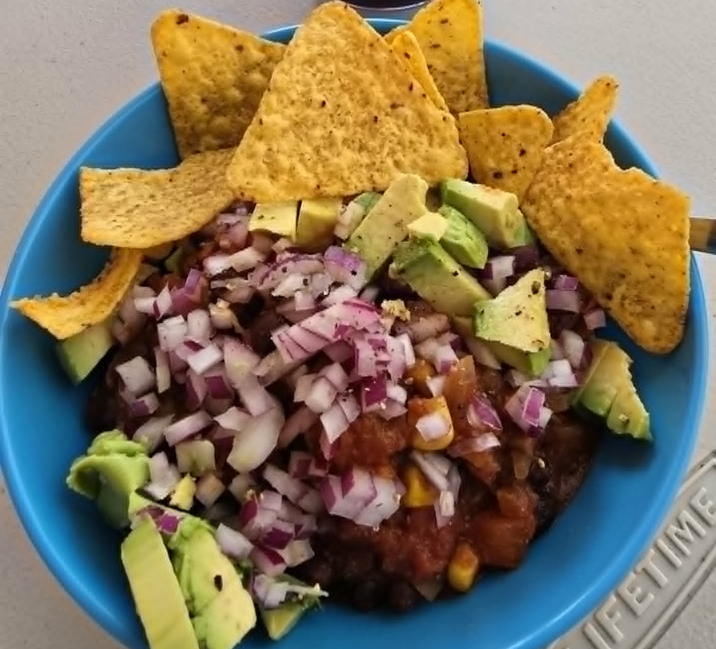 Warm Nacho Beans with plenty of serving options!